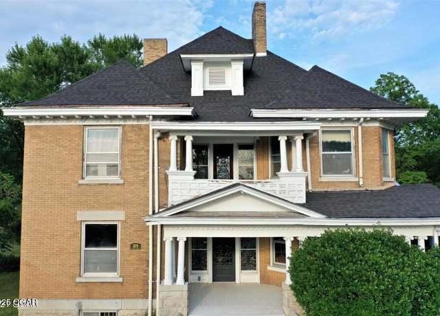Property at 109 S Pine St, Carterville, MO 64835, 6 beds, 2.5 baths