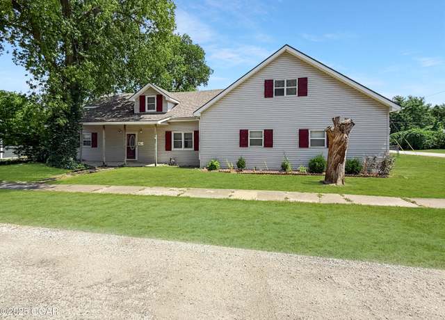 Property at 309 S Elm St, Carterville, MO 64835, 4 beds, 2.5 baths