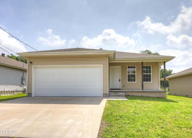 Property at 611 S Arch St, Carterville, MO 64835, 3 beds, 2 baths
