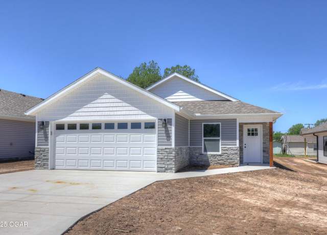 Property at 516 Harrison St, Carterville, MO 64835, 4 beds, 2 baths