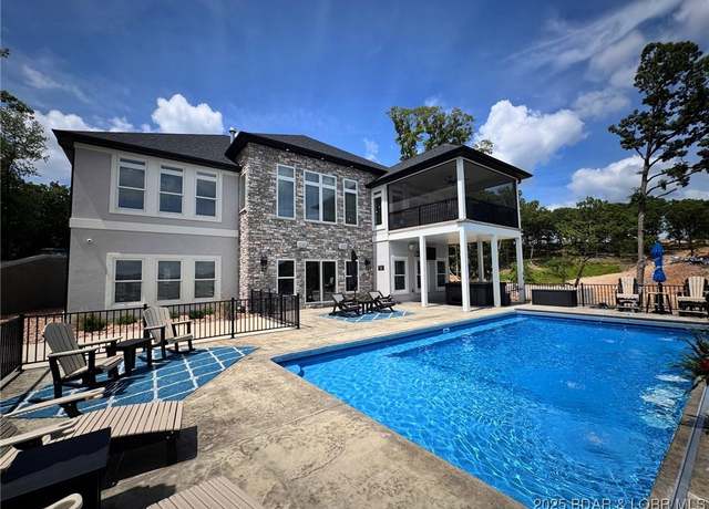 Property at 243 E Villages Estates Rd, Sunrise Beach, MO 65079, 5 beds, 5.5 baths