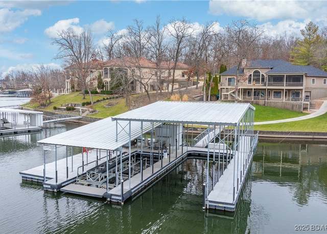 Property at 1069 Muirfield Dr, Porto Cima, MO 65079, 5 beds, 3.5 baths