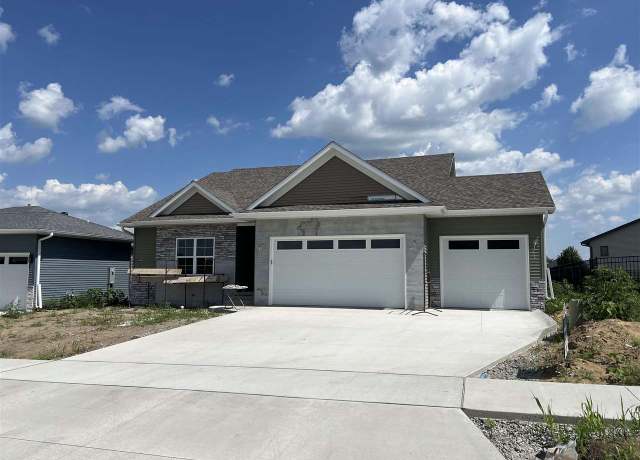 Property at 1223 Covered Wagon Dr, Iowa City, IA 52240, 5 beds, 3 baths