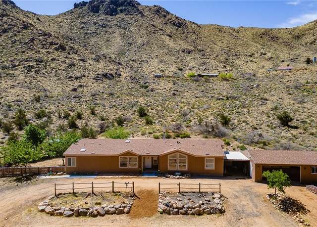 Property at 114 W Vock Canyon Rd, Kingman, AZ 86409, 4 beds, 2.5 baths