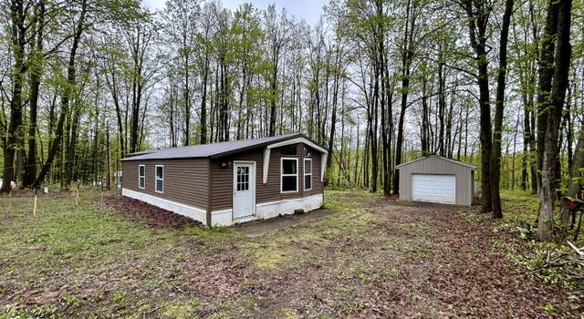 Photo of 8448 Heatherton Cir, Mancelona, MI 49659