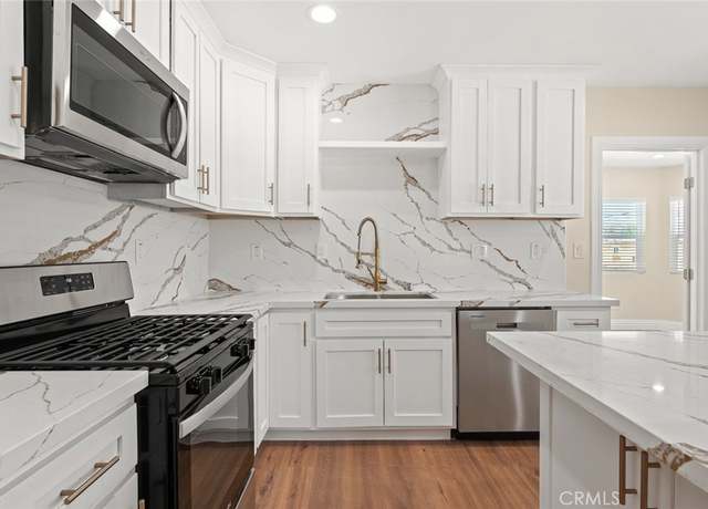 Property at 7513 S Cimarron St, Los Angeles, CA 90047, 5 beds, 5 baths