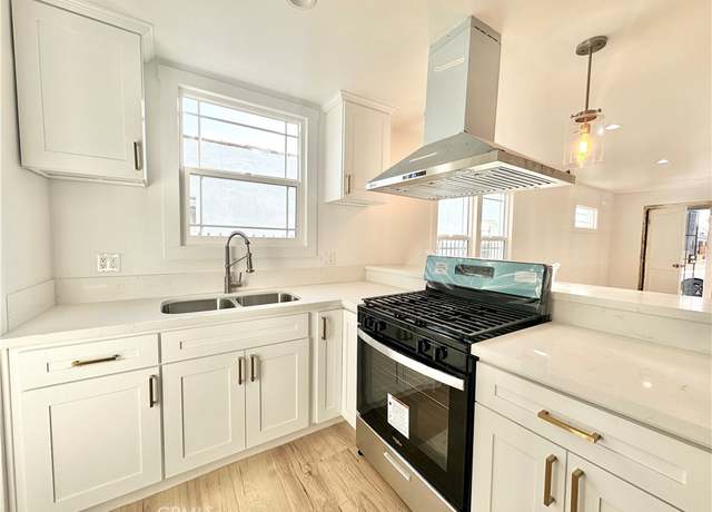 Property at 5718 S Manhattan Pl, Los Angeles, CA 90062, 6 beds, 4 baths