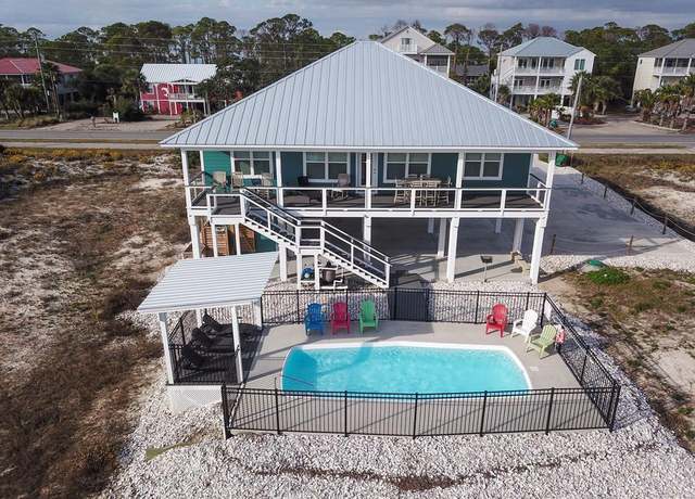 Property at 1056 E Gulf Beach Dr, St. George Island, FL 32328, 4 beds, 4 baths