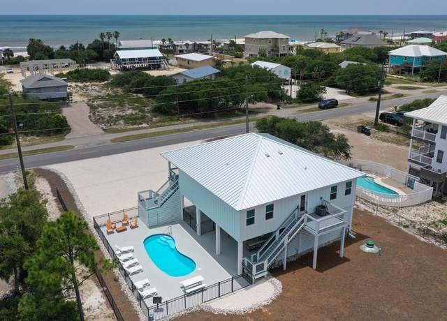 Property at 941 W Gulf Beach Dr, St. George Island, FL 32328, 4 beds, 4 baths