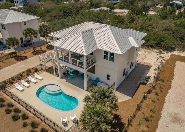 Property at 557 W Gulf Beach Dr, St. George Island, FL 32328, 4 beds, 3 baths