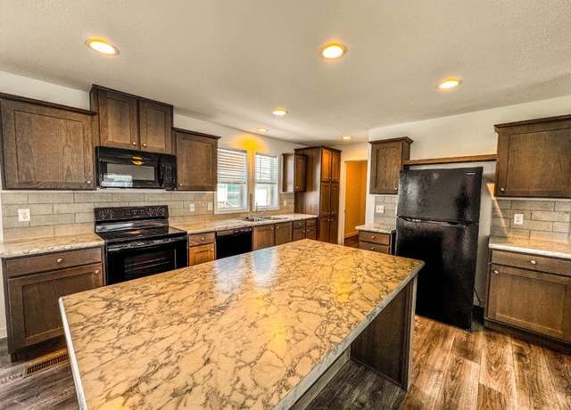 Property at 1006 E Park St, Gardner, KS 66030, 3 beds, 2 baths