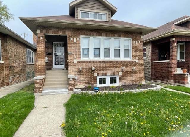 Property at 8035 S Oglesby Ave, Chicago, IL 60617, 4 beds, 2 baths