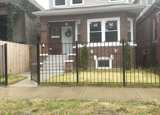 Property at 7124 S Woodlawn Ave, Chicago, IL 60619, 4 beds, 3 baths