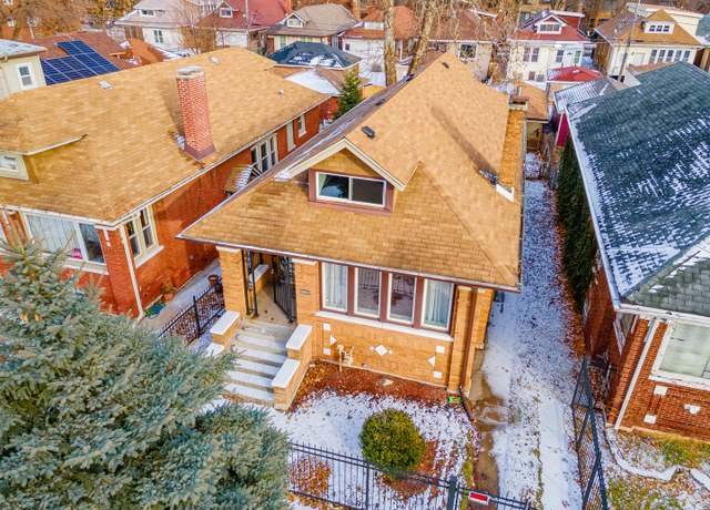 Property at 7715 S Oglesby Ave, Chicago, IL 60649, 5 beds, 2.5 baths