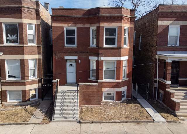 Property at 7047 S Carpenter St, Chicago, IL 60621, 5 beds, 3 baths