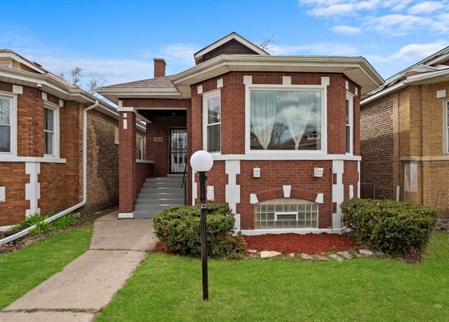 Property at 8214 S Paxton Ave, Chicago, IL 60617, 5 beds, 3 baths