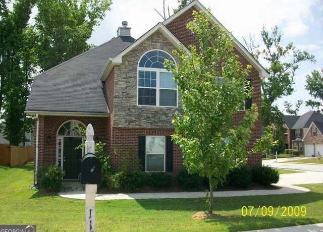 Property at 11599 Flemmings Cove Dr, Hampton, GA 30228, 4 beds, 3 baths