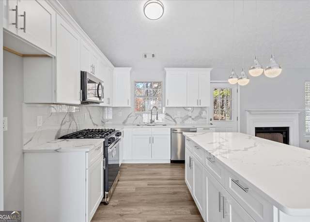 Property at 5950 Milligan Ct, Atlanta, GA 30349, 4 beds, 3 baths