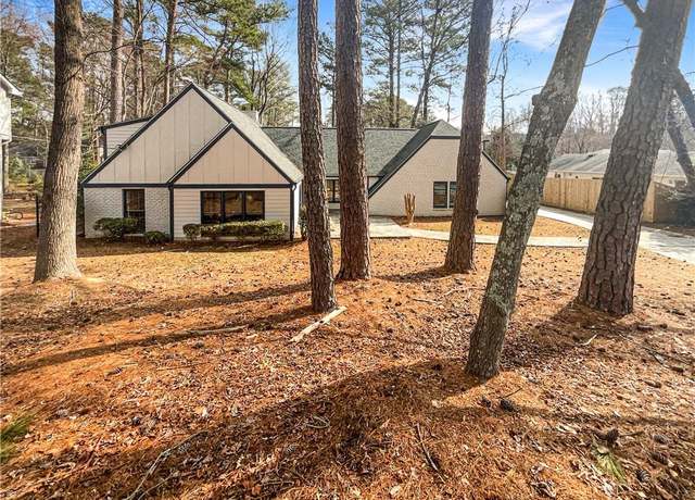 Property at 7040 Northgreen Dr, Atlanta, GA 30328, 5 beds, 3 baths