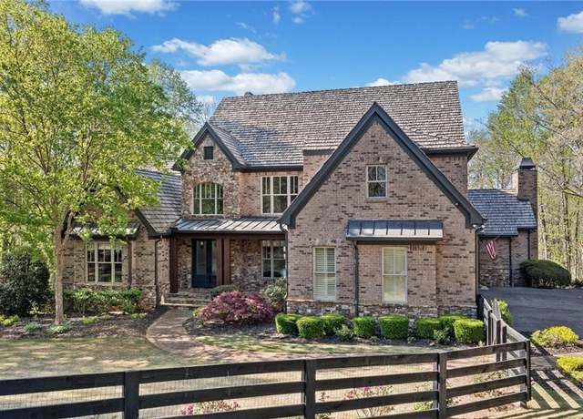 Property at 411 River Bluff Ln, Ball Ground, GA 30107, 5 beds, 5.5 baths