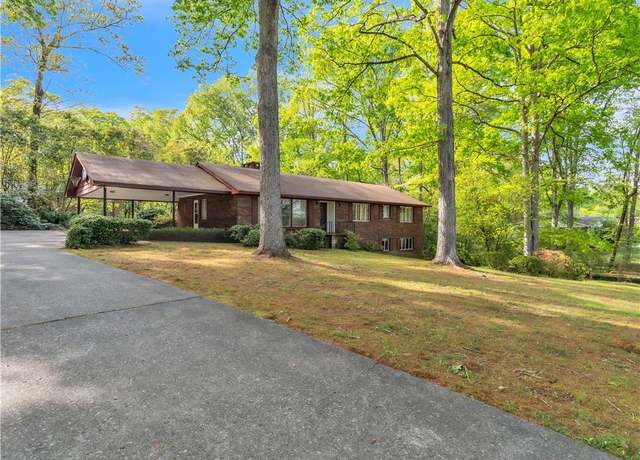 Property at 218 Woodland Dr, Calhoun, GA 30701, 4 beds, 3 baths