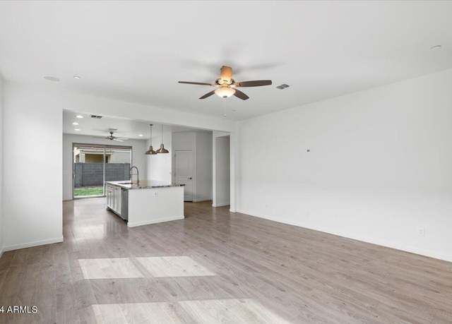 Property at 21451 W Palm Ln, Buckeye, AZ 85396, 4 beds, 2 baths