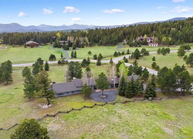Property at 32399 Woodland Dr, Evergreen, CO 80439, 5 beds, 4 baths