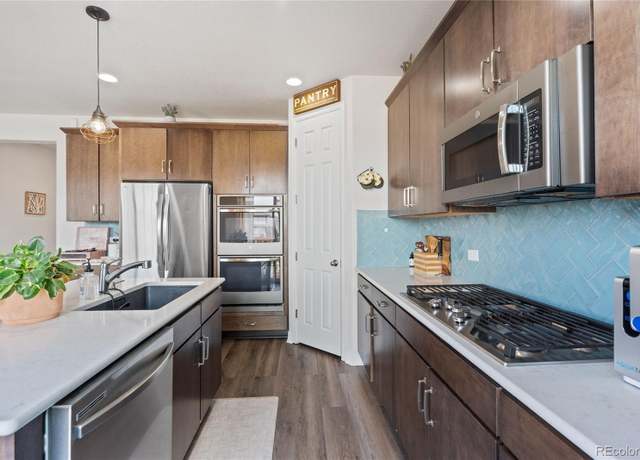 Property at 7410 S Old Hammer Way, Aurora, CO 80016, 4 beds, 3 baths