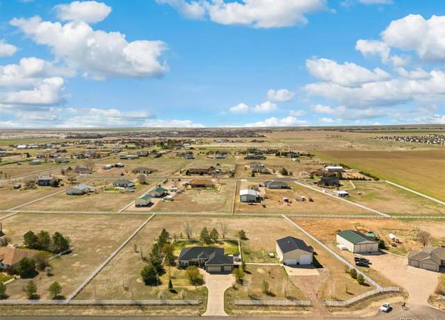 Property at 56330 E 37th Ct, Strasburg, CO 80136, 5 beds, 3 baths