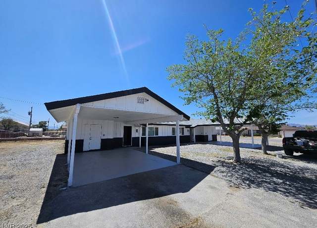 Property at 1083 E Calvada Blvd, Pahrump, NV 89048, 4 beds, 2 baths