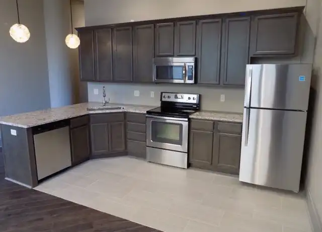 Property at Come live in the Parker Building in Downtown Davenport. - 212 N Brady St, Davenport, IA, 52801, 1-2 bed, 1-2 bath, [object Object]
