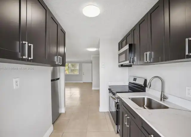Property at 850 E Commercial Blvd Unit 214B, Oakland Park, FL, 33334, 3 beds, 2 baths, [object Object]