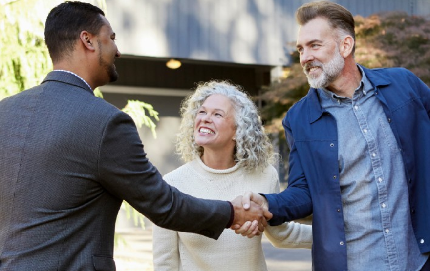 A lovely couple and their Redfin agent