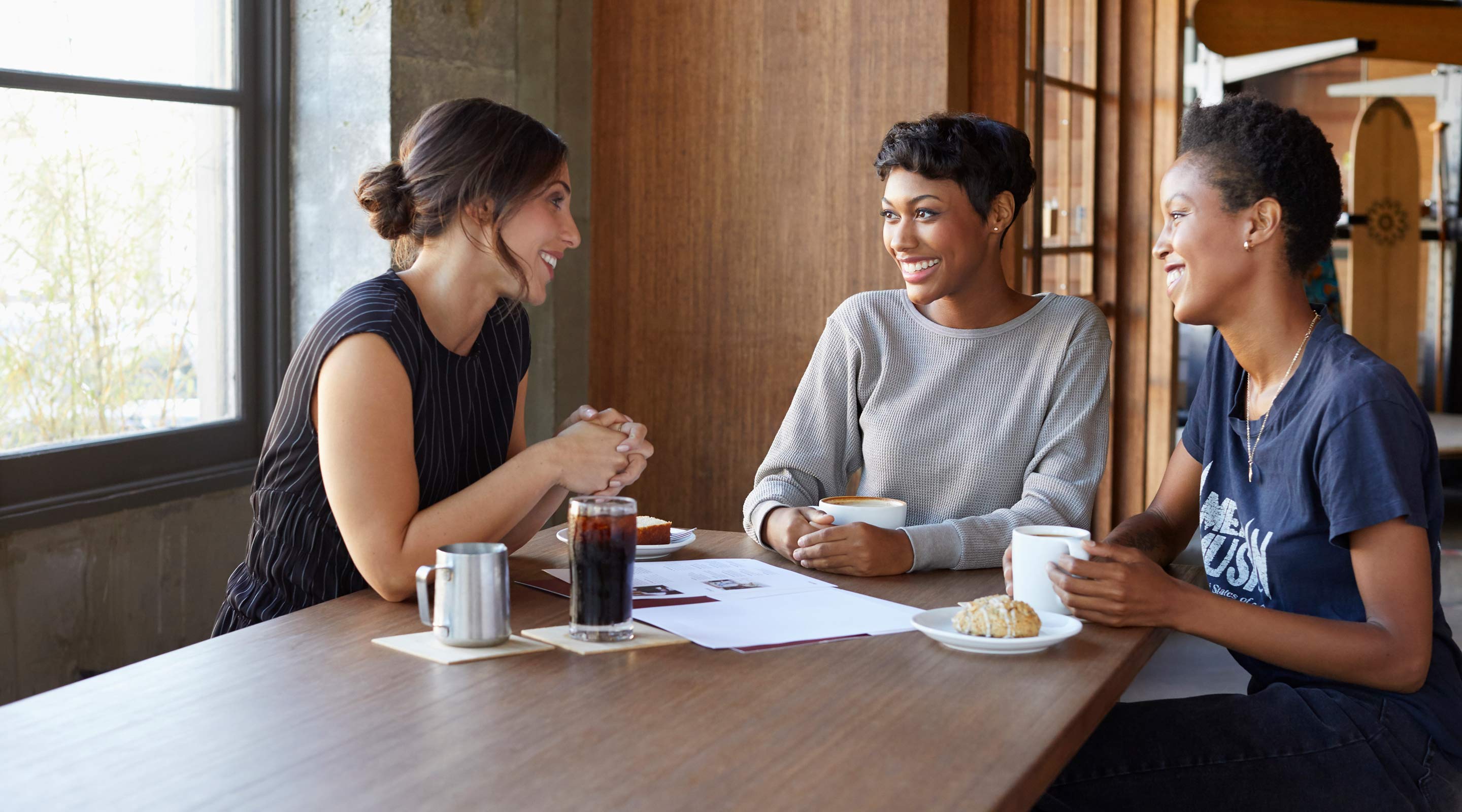 Agent with clients at a table