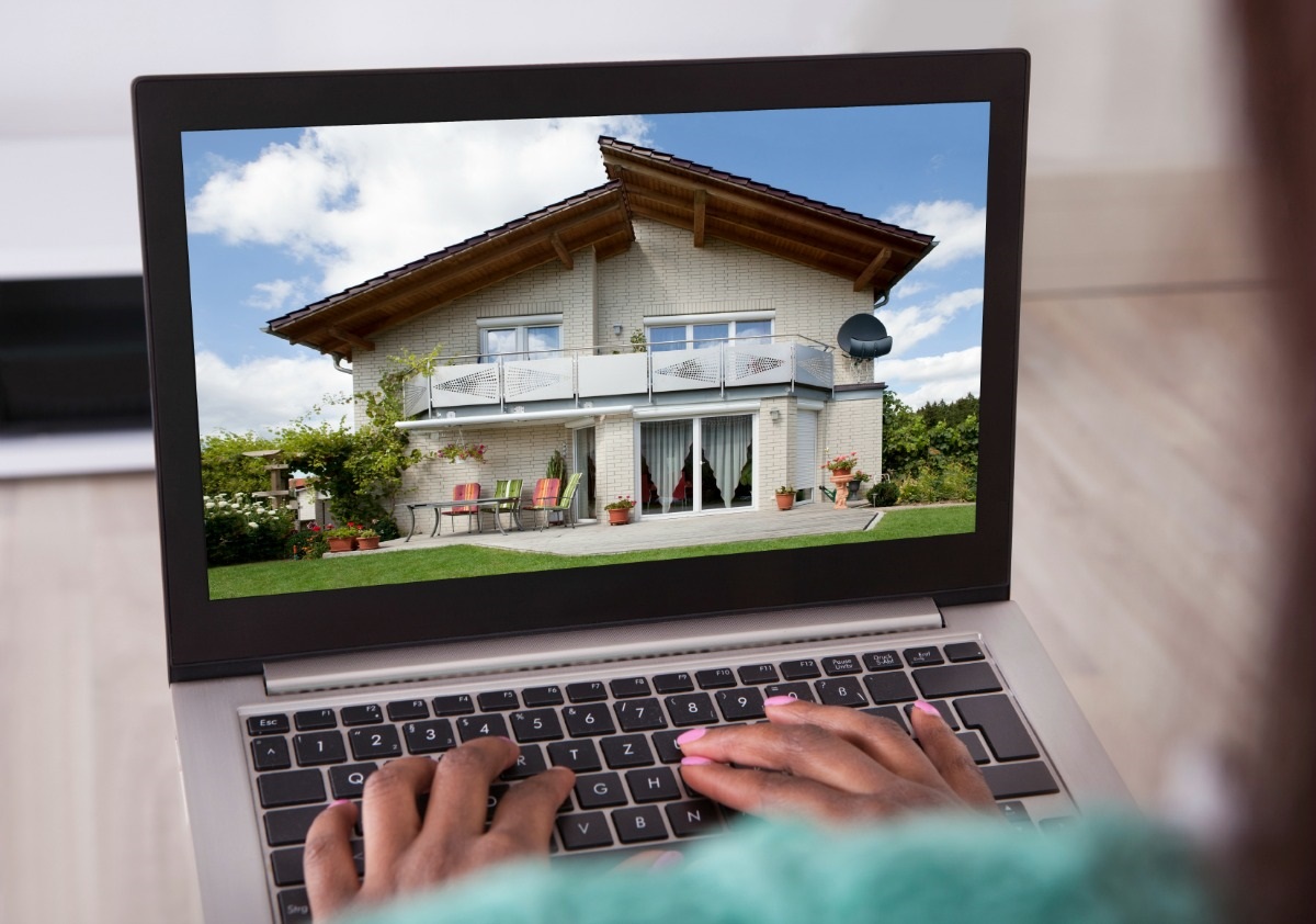 Someone looking at a home for sale on a computer screen