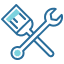 A paintbrush and a wrench